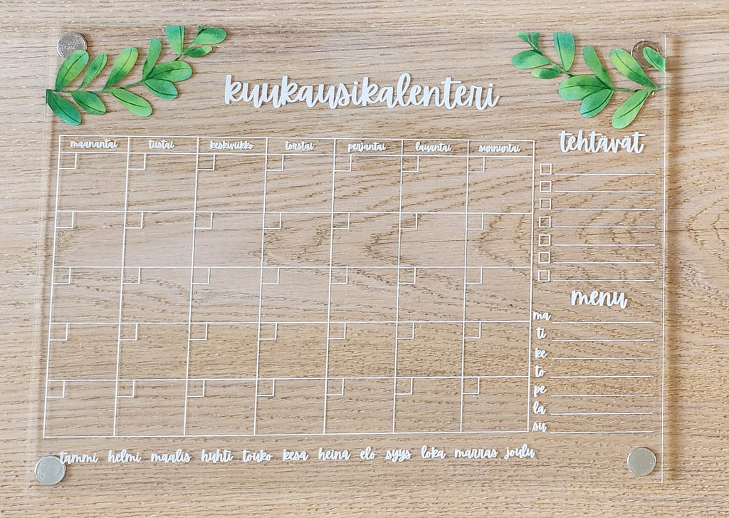 Kuukausikalenteri jääkaapin oveen